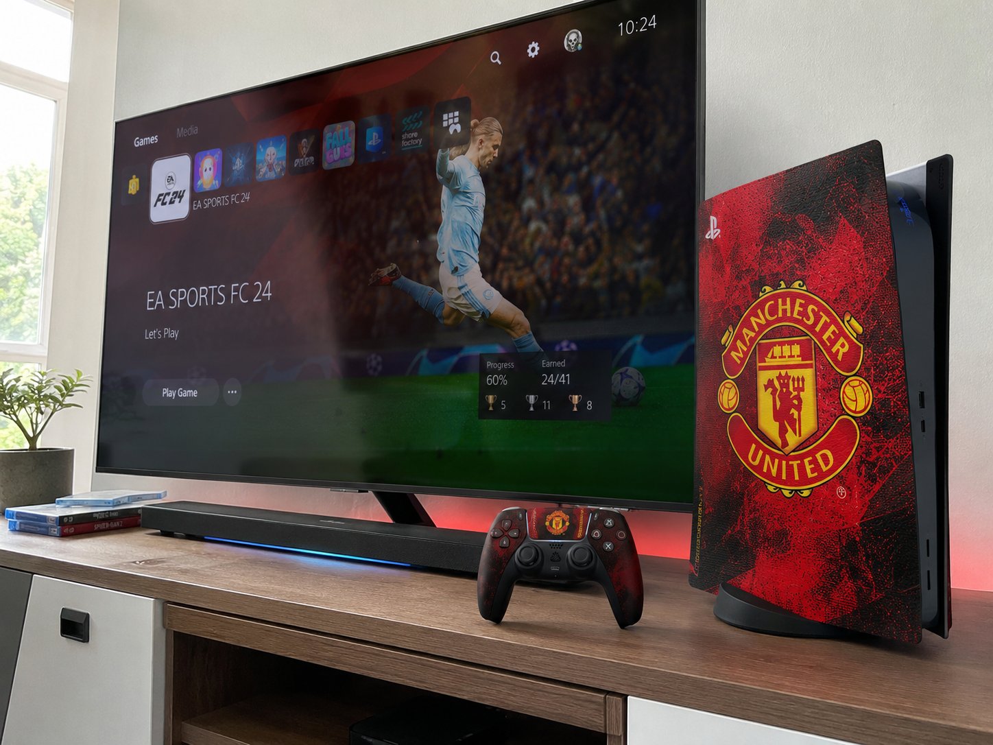 Customer media console setup with the Man United custom PS5 skin