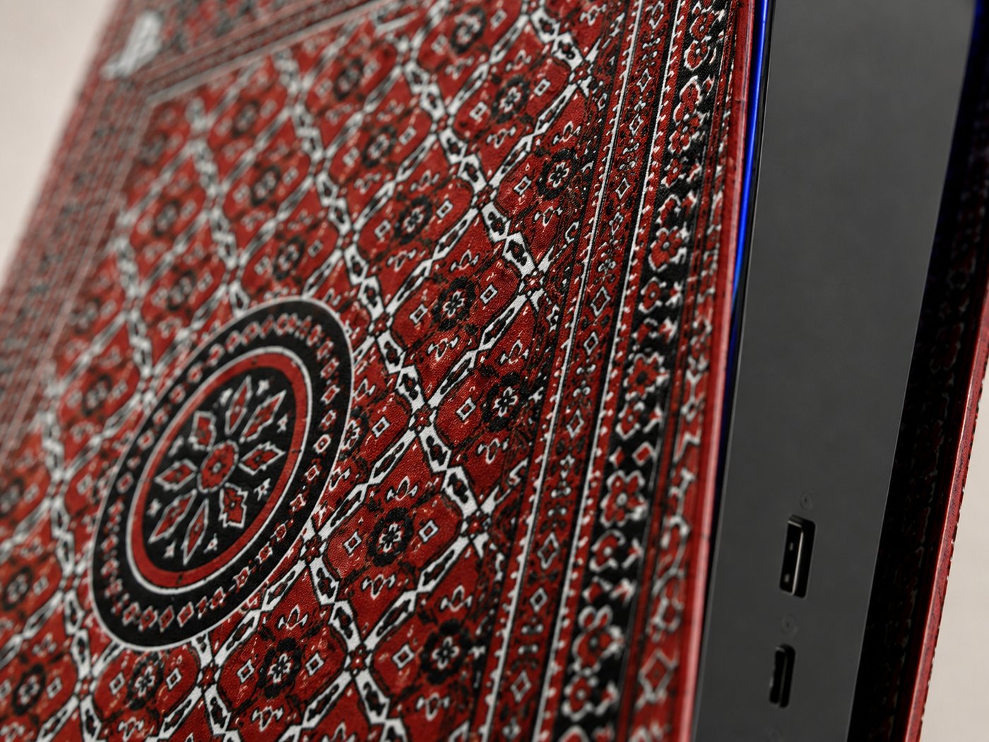 Macro shot of the Ajrak skin's edge and USB ports