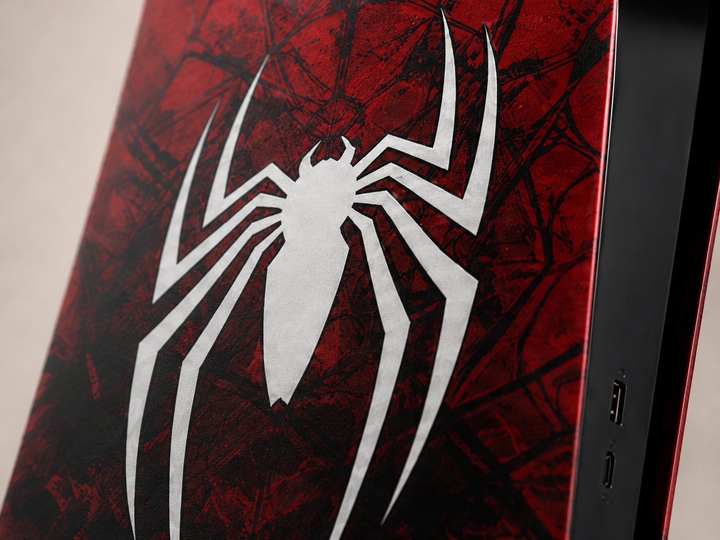 Macro shot of the Webslinger spider emblem and edge detail
